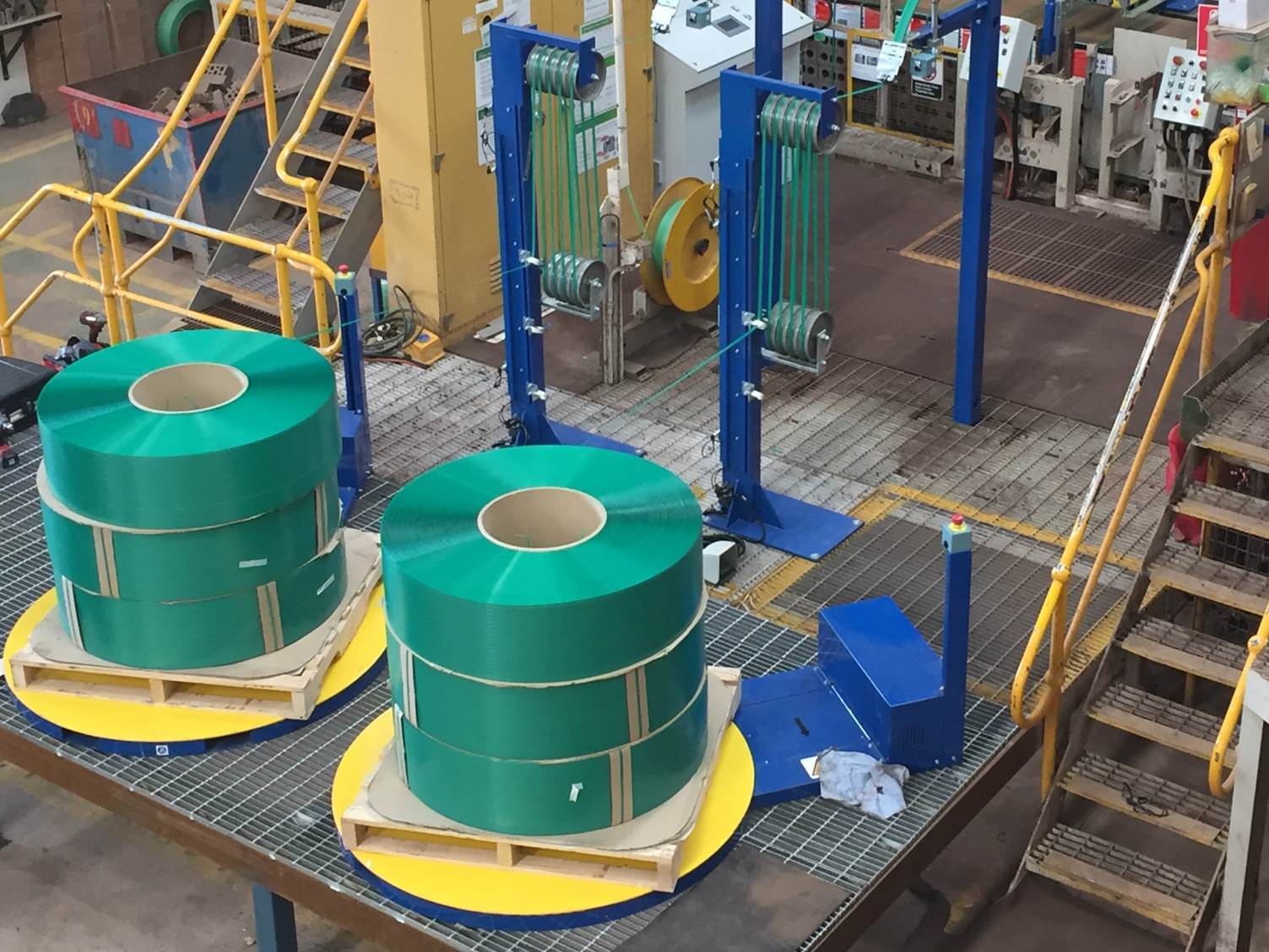 Industrial strapping machinery in high-volume warehouse operation